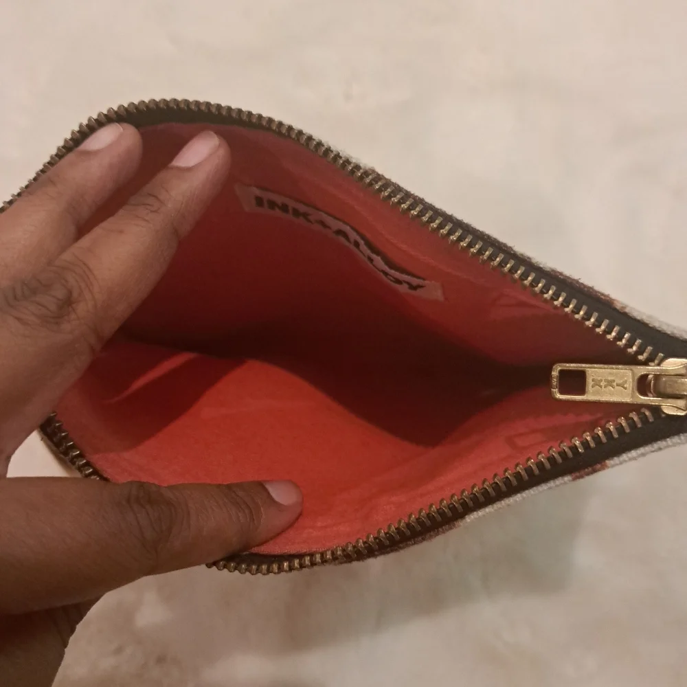 Ink & Alloy O-Ring Clutch Bag